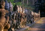 Devas are often seen in opposition to Asuras (sinful deities).<br/><br/>

Angkor Thom, meaning 'The Great City', is located one mile north of Angkor Wat. It was built in the late 12th century by king Jayavarman VII, and covers an area of 9 km², within which are located several monuments from earlier eras as well as those established by Jayavarman and his successors. It is believed to have sustained a population of 80,000-150,000 people. At the centre of the city is Jayavarman's state temple, the Bayon, with the other major sites clustered around the Victory Square immediately to the north.<br/><br/>

Angkor Thom was established as the capital of Jayavarman VII's empire, and was the centre of his massive building programme. One inscription found in the city refers to Jayavarman as the groom and the city as his bride.<br/><br/>

Angkor Thom seems not to be the first Khmer capital on the site, however, as Yasodharapura, dating from three centuries earlier, was centred slightly further northwest.<br/><br/>

The last temple known to have been constructed in Angkor Thom was Mangalartha, which was dedicated in 1295. In the following centuries Angkor Thom remained the capital of a kingdom in decline until it was abandoned some time prior to 1609. 
