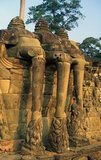 The Terrace of the Elephants was used by King Jayavarman VII to review his victorious army.<br/><br/>

Angkor Thom, meaning ‘The Great City’, is located one mile north of Angkor Wat. It was built in the late 12th century by King Jayavarman VII, and covers an area of 9 km², within which are located several monuments from earlier eras as well as those established by Jayavarman and his successors. It is believed to have sustained a population of 80,000-150,000 people.<br/><br/>

At the centre of the city is Jayavarman's state temple, the Bayon, with the other major sites clustered around the Victory Square immediately to the north. Angkor Thom was established as the capital of Jayavarman VII's empire, and was the centre of his massive building programme. One inscription found in the city refers to Jayavarman as the groom and the city as his bride.<br/><br/>

Angkor Thom seems not to be the first Khmer capital on the site, however, as Yasodharapura, dating from three centuries earlier, was centred slightly further northwest. The last temple known to have been constructed in Angkor Thom was Mangalartha, which was dedicated in 1295. In the following centuries Angkor Thom remained the capital of a kingdom in decline until it was abandoned some time prior to 1609. 